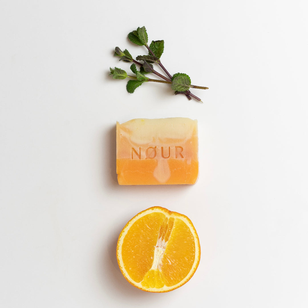 nour seife sundowner mit orange und minzblatt